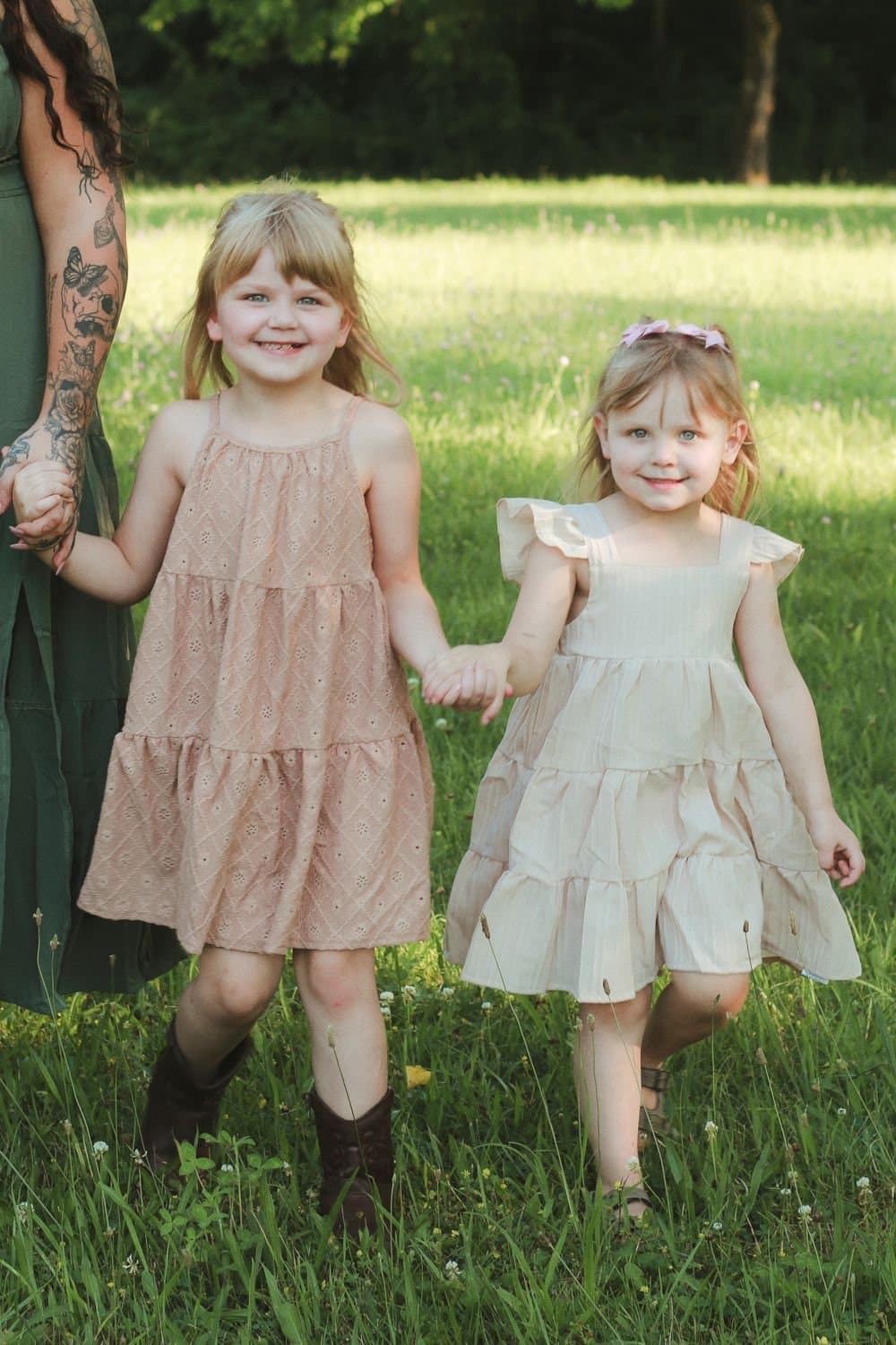 Two girls walking through golden grass